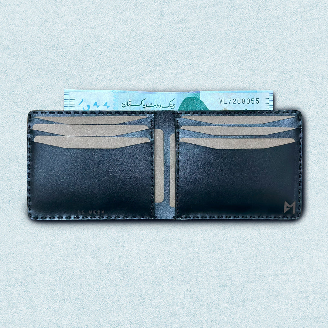 Open black leather bifold wallet for men showing 8 card slots and 1 cash slot, with python-pattern exterior, hand-stitched.