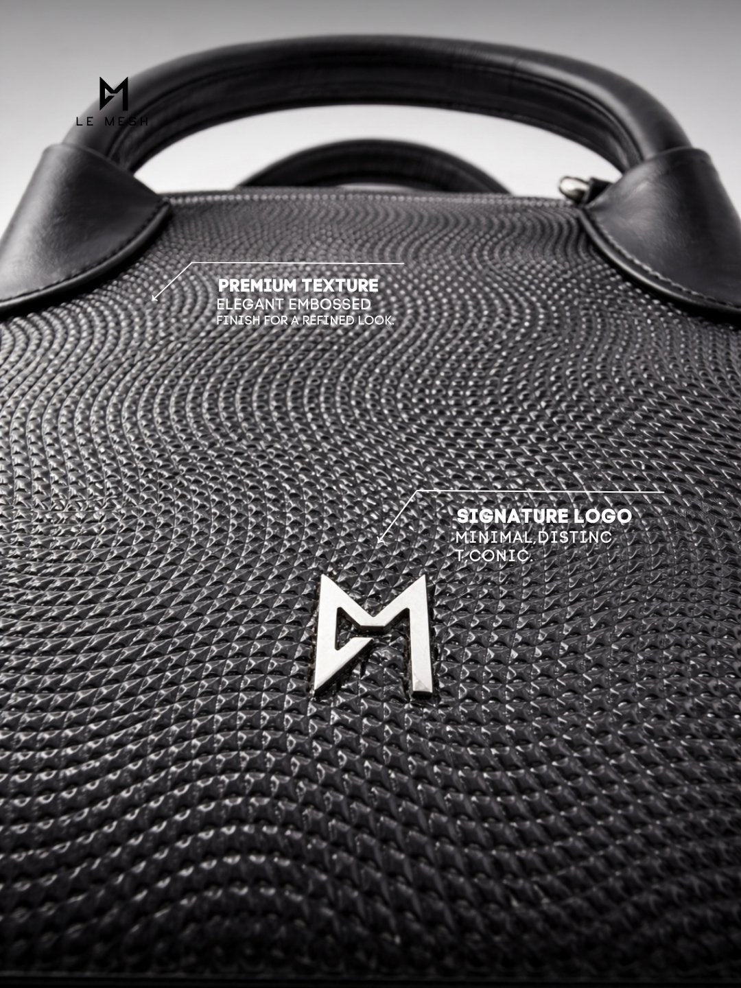 Black textured handbag with a brand logo on a gray background