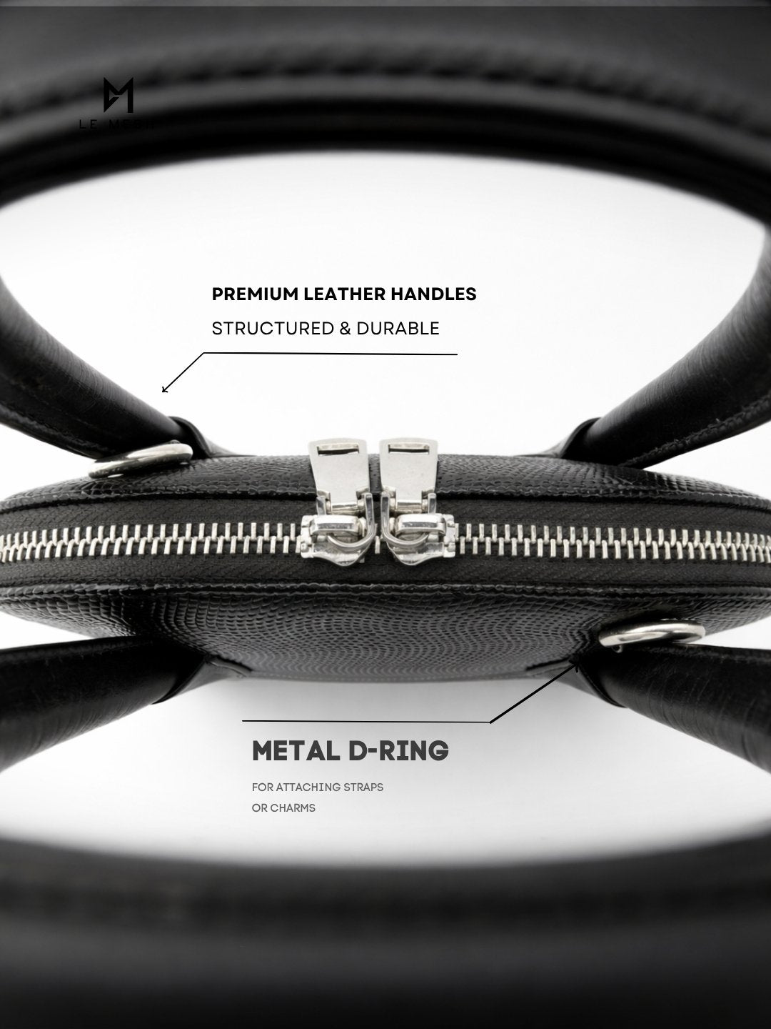 Black leather bag with metal D-ring and premium leather handles on a white background
